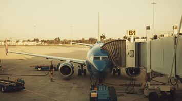 A large jetliner sitting on top of an airport tarmac