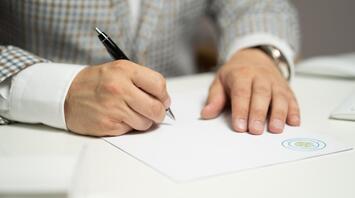 Man signing important documents