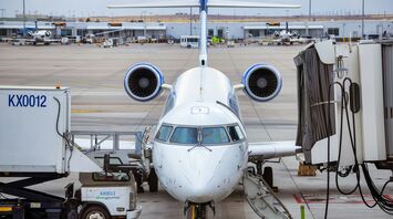 A large jetliner sitting on top of an airport tarmac