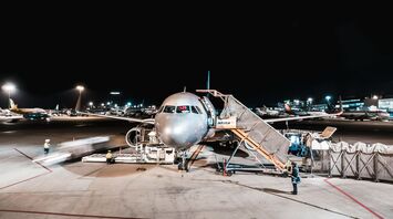 Person standing near airliner