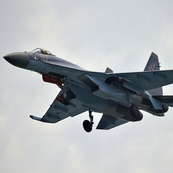 War plane under white clouds