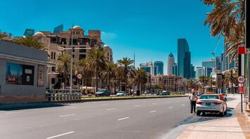 Houses in the UAE and the road with a taxi