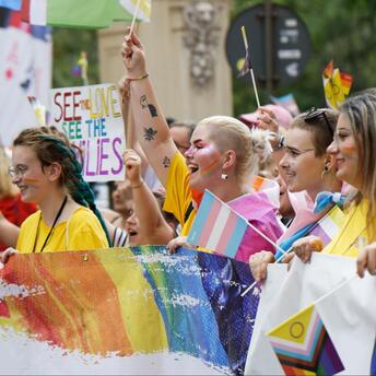 Girls with lgbt flags at the parade