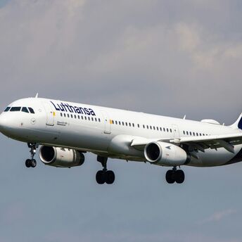 White and blue plane during daytime