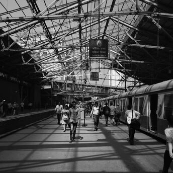 a-black-and-white-photo-of-a-train-station