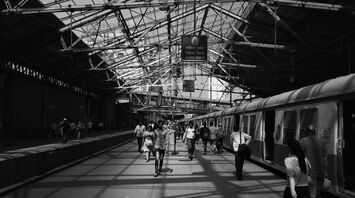a-black-and-white-photo-of-a-train-station