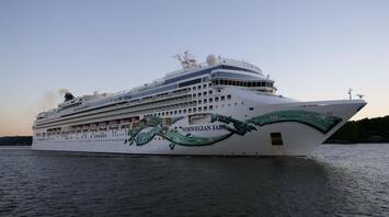 Huge cruise ship in all its glory in the middle of the sea