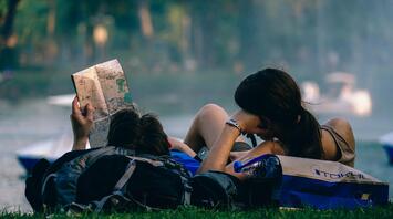 Two young people are looking at a map