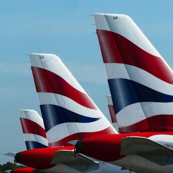 The tails of British Airways aircraft displaying the airline's red, white, and blue logo