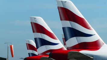 The tails of British Airways aircraft displaying the airline's red, white, and blue logo