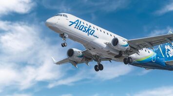 Alaska Airlines plane flying in the sky