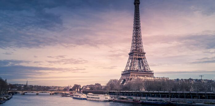 Eiffel Tower at sunset with a view of the Seine River 