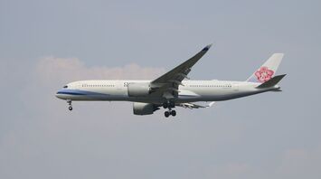 A large airplane flying in the sky