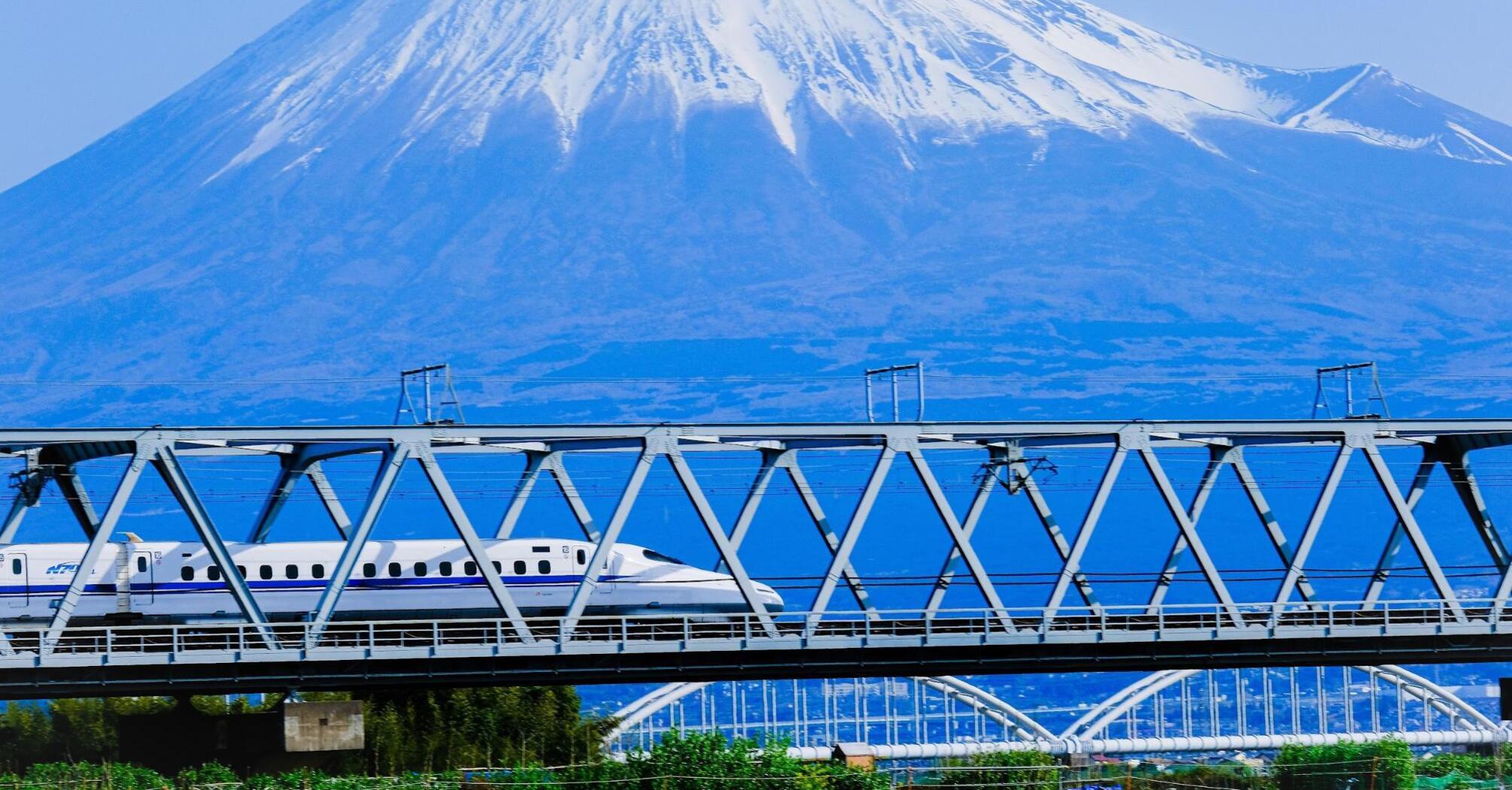 High-speed train on the bridge near the mountains