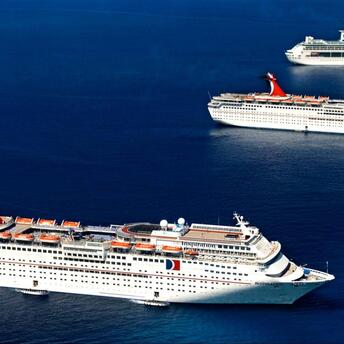 Three cruise ships on the open ocean