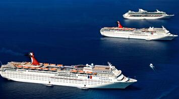 Three cruise ships on the open ocean