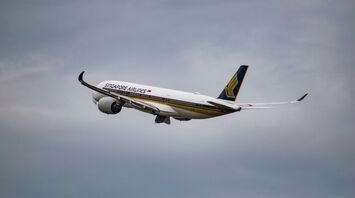 White singapore airlines airplane flying during cloudy day