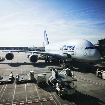 A large jetliner sitting on top of an airport tarmac