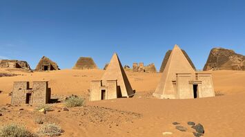 A group of pyramids sitting in the middle of a desert
