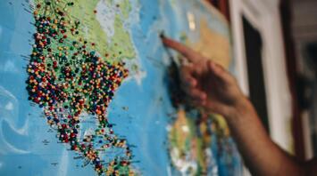 A man points to the next point of his journey on the map