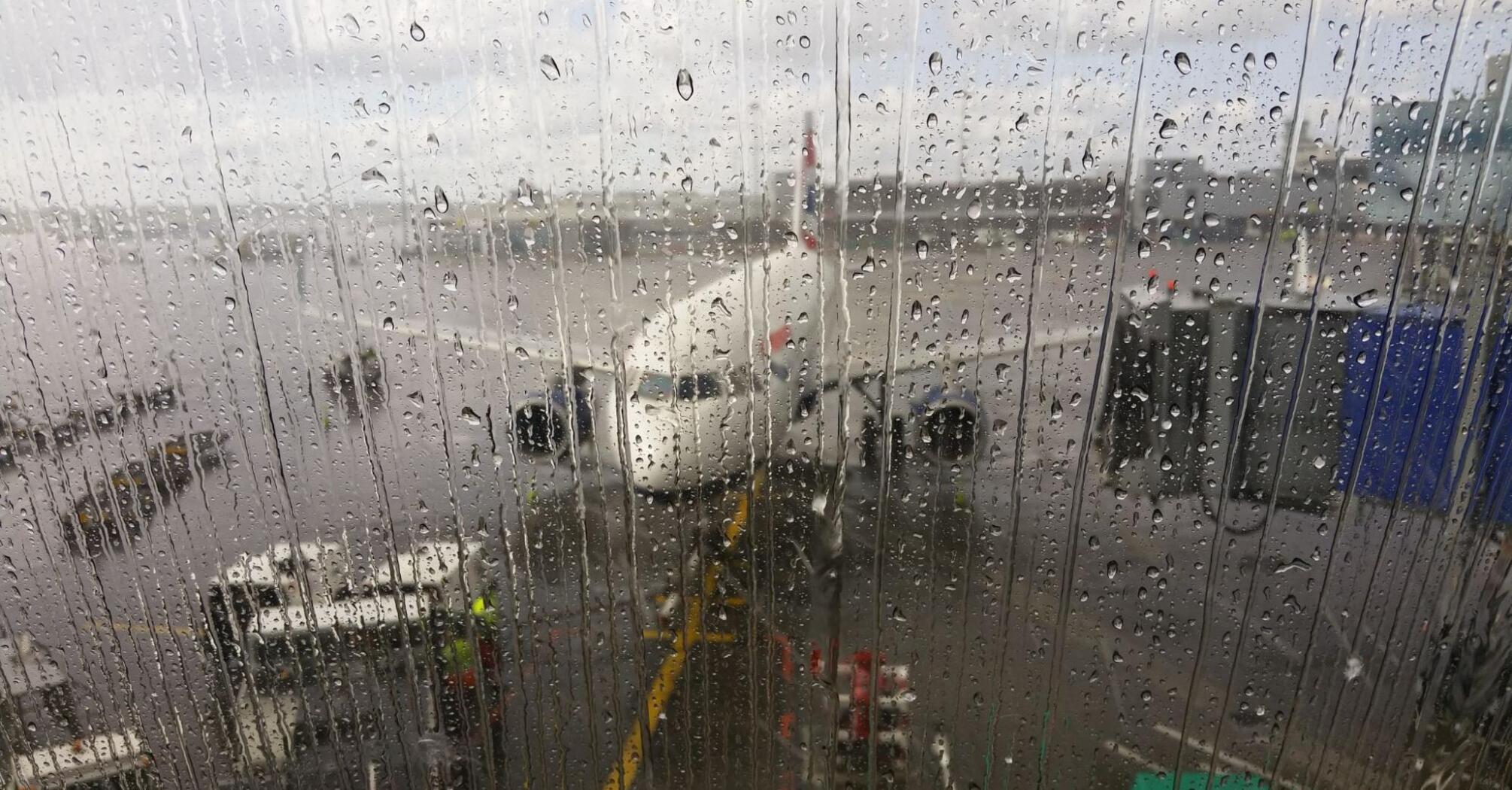 Airplane outside a wet window