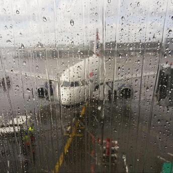 Airplane outside a wet window