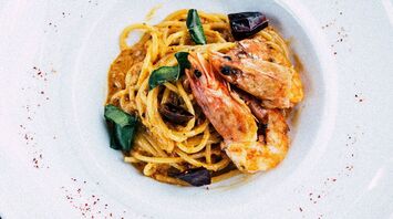 Shrimp pasta in white bowl