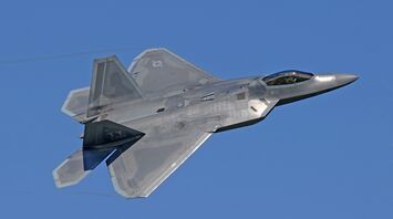 Flying gray jet plane