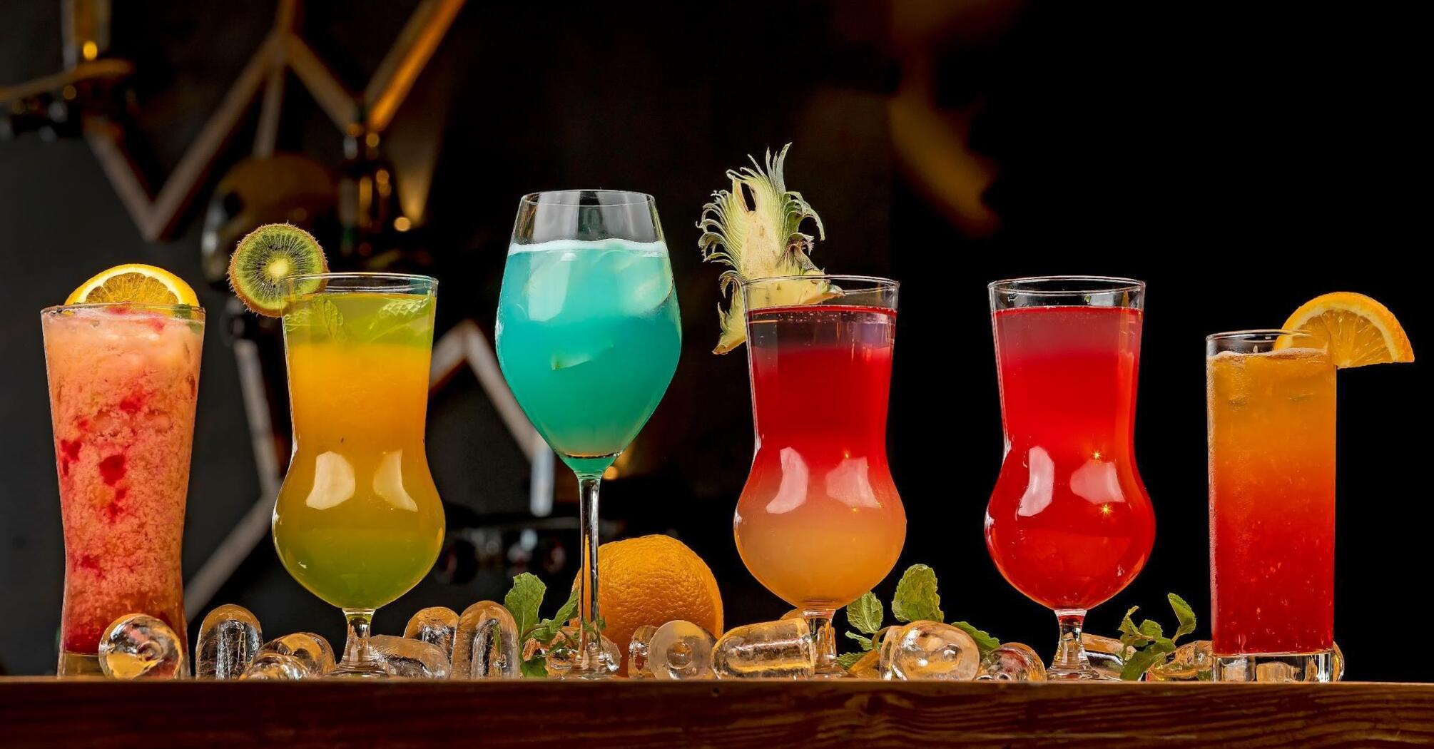 Cocktails in different colors on the bar counter