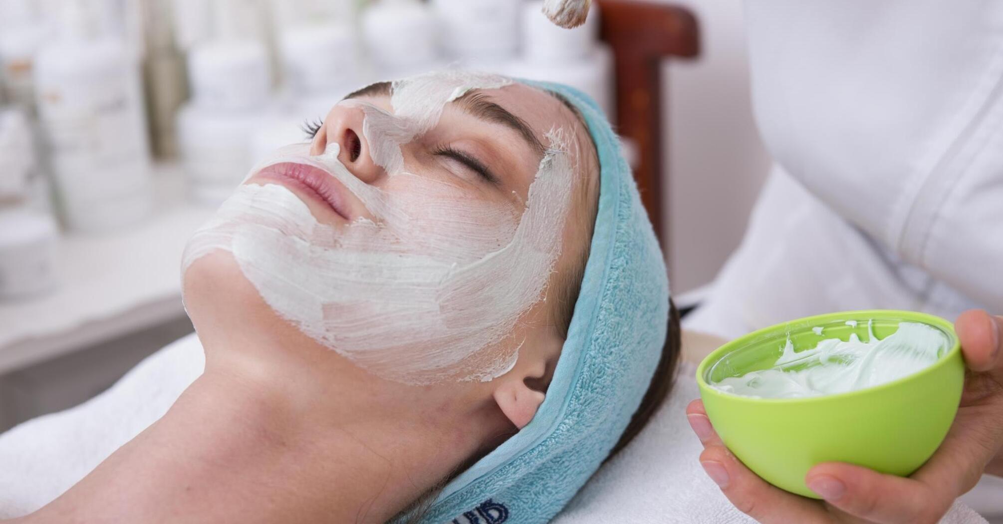 Woman undergoing beauty treatments in a spa salon