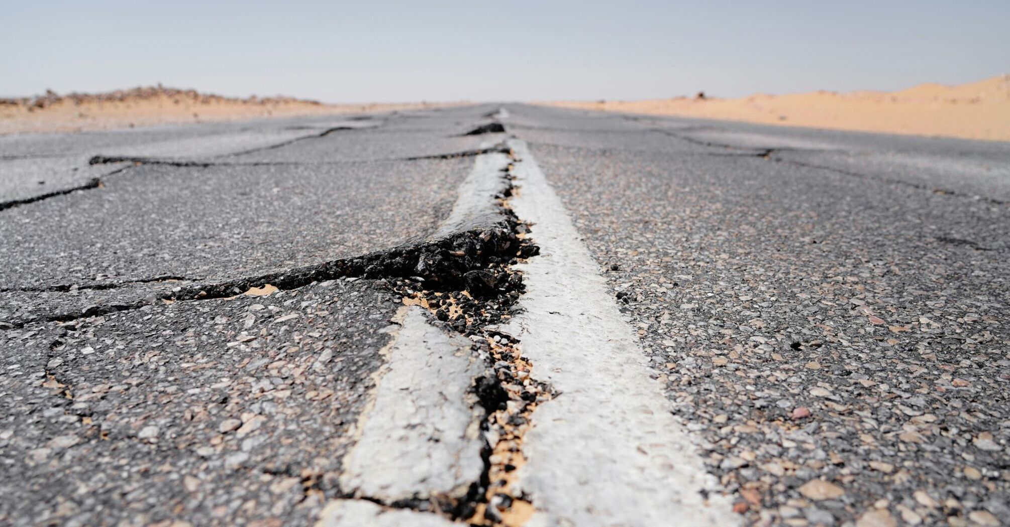 A crack in the middle of a road in the middle of nowhere