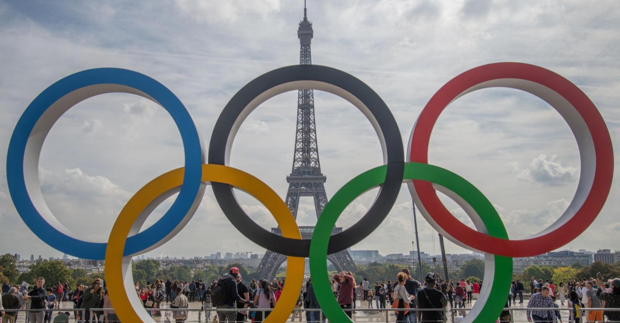 Olympic rings with the Eiffel Tower in the background