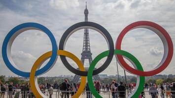 Olympic rings with the Eiffel Tower in the background