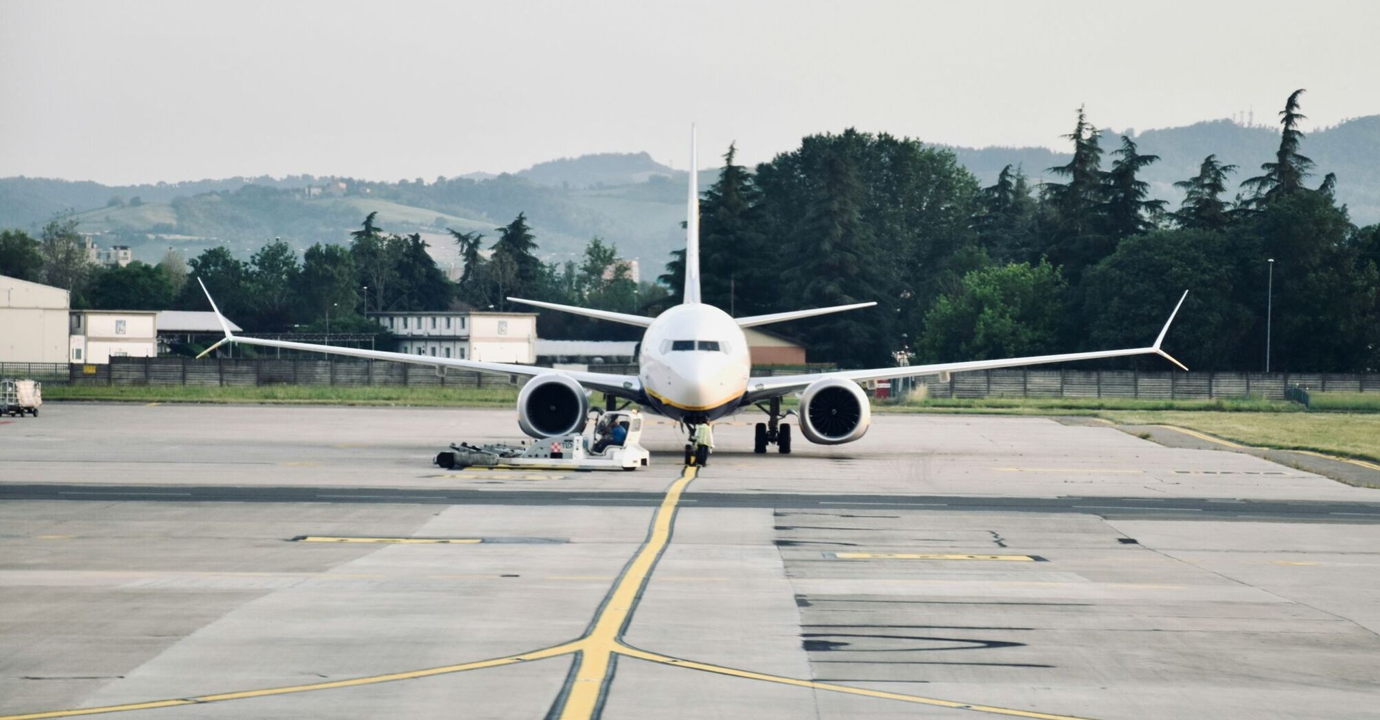 A large passenger jet sitting on top of an airport tarmac