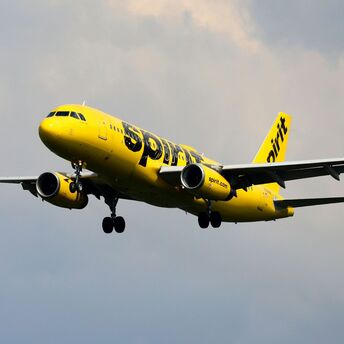 Spirit Airlines plane flying in the sky