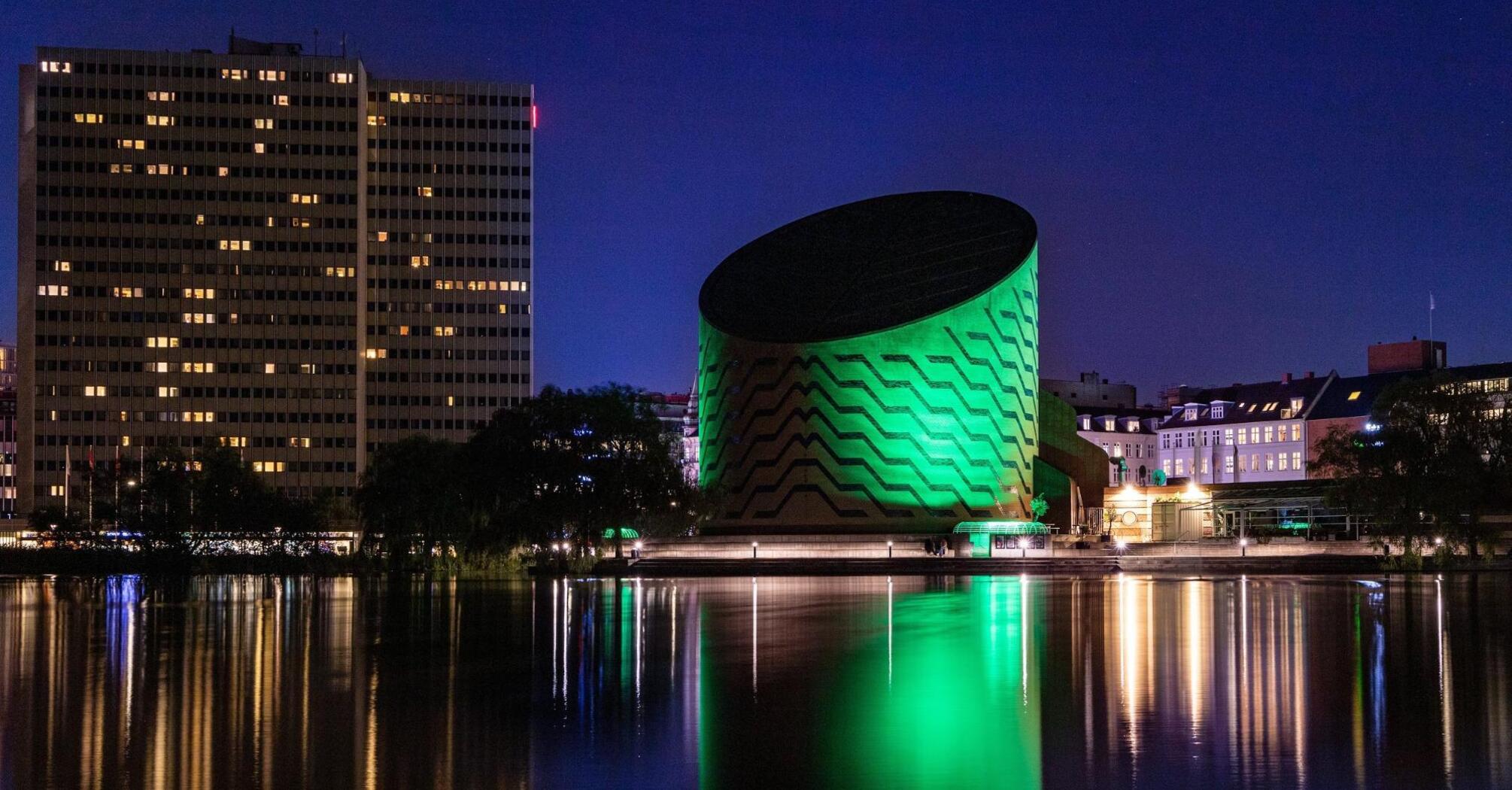 Night city Copenhagen on the shore of the lake