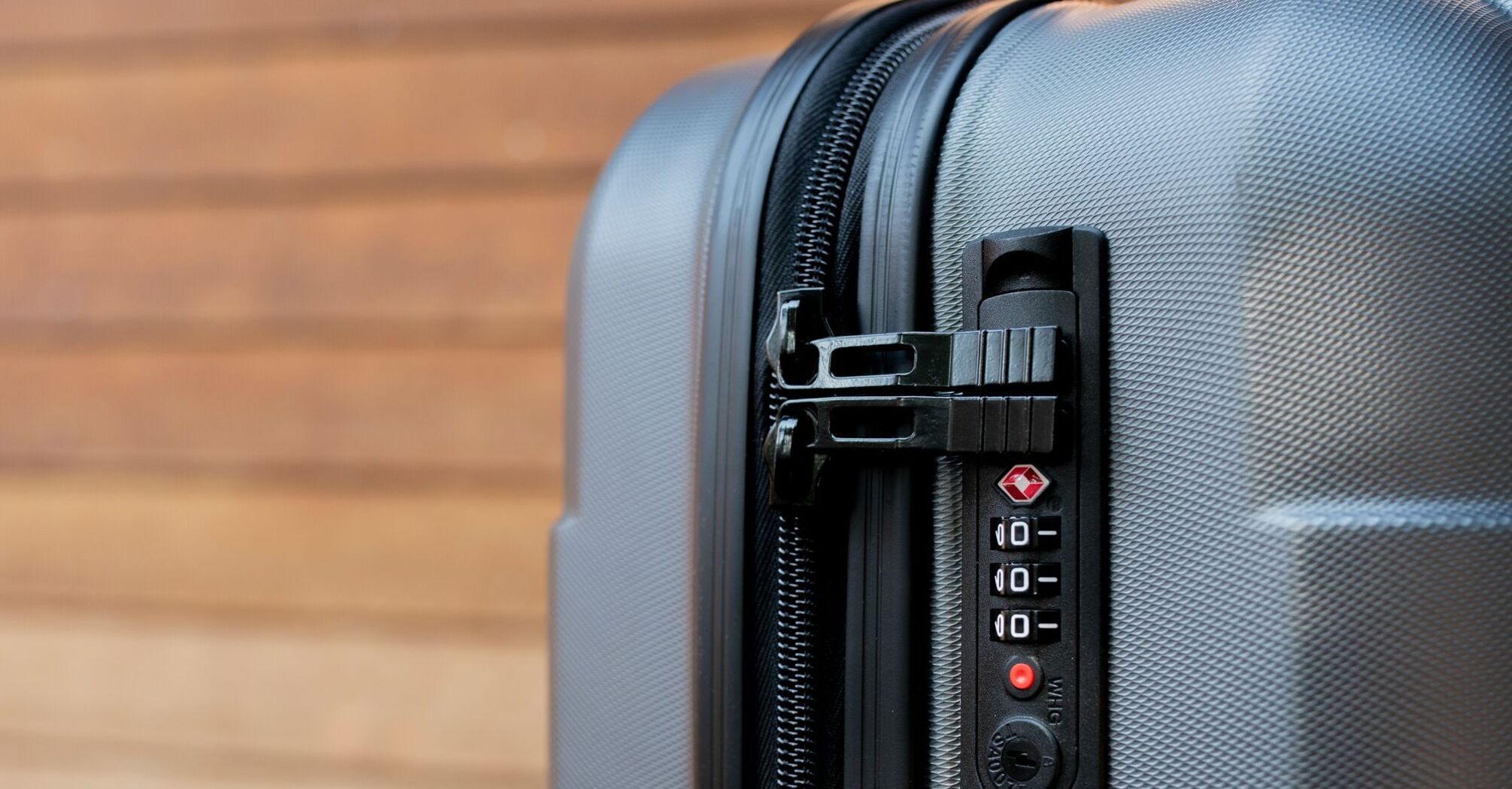 Close-up of a combination lock on a grey suitcase