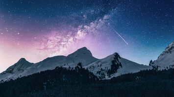 Snow-covered mountains under a starry sky with a meteor and a pink galactic nebula