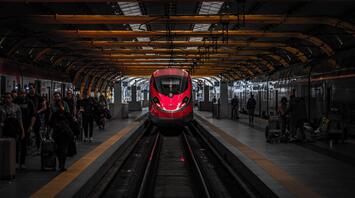Red train arrives at the station