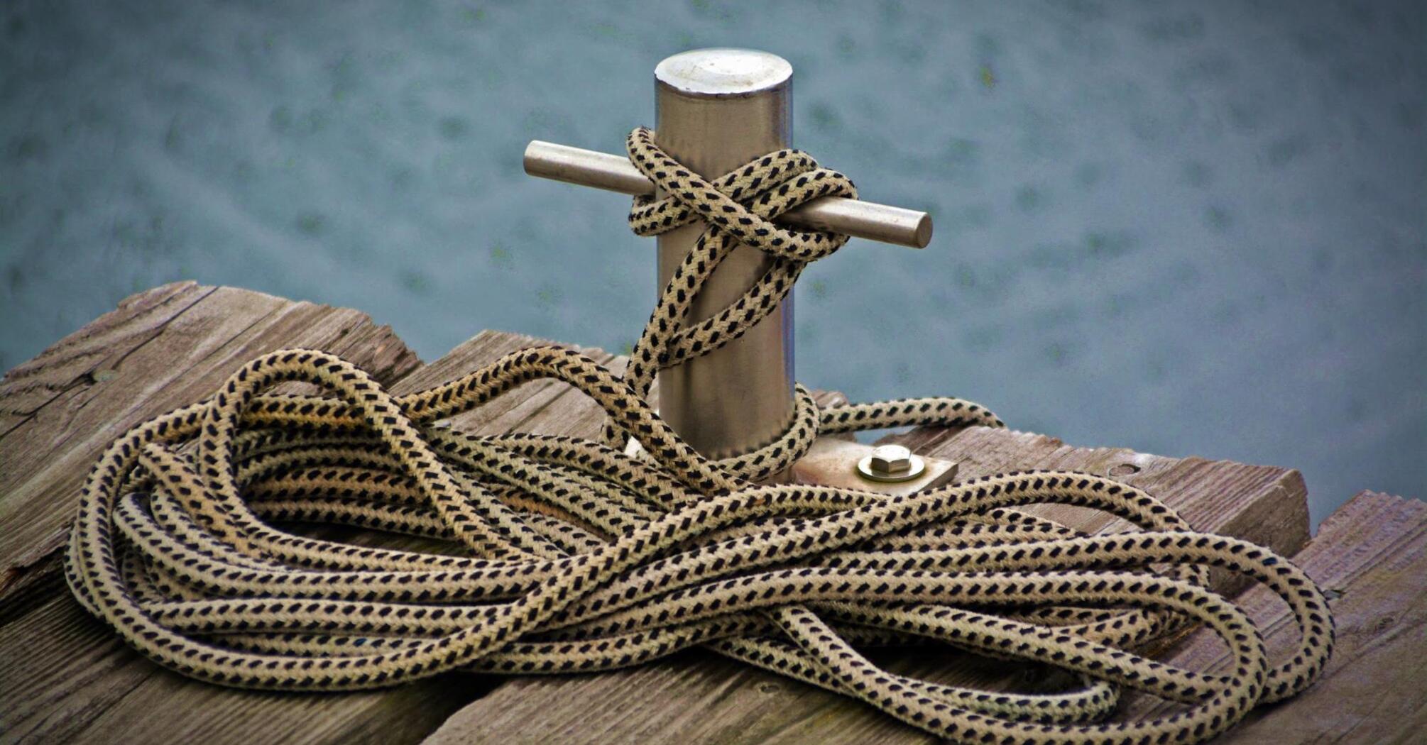 А rope is tied to the wharf