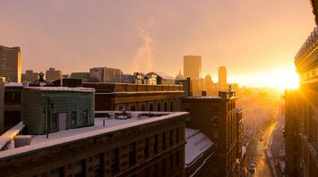Sunrise over a snowy Boston skyline