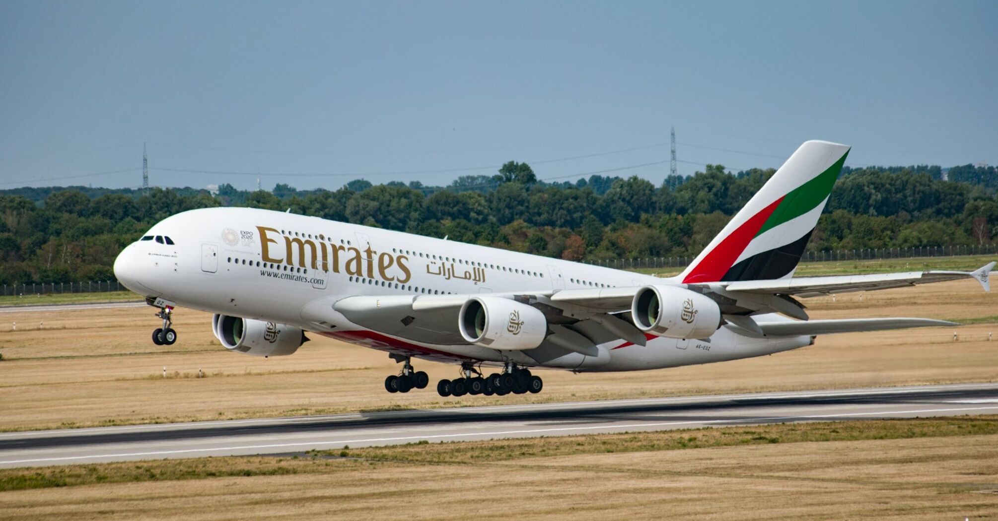 Emirates airplane taking off from a runway