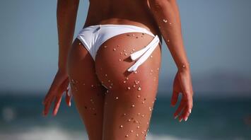Woman in a swimsuit against the background of the sea
