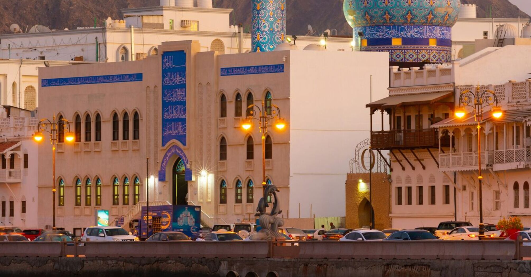 A picturesque view of a vibrant blue and gold mosque with a dome