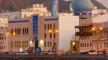 A picturesque view of a vibrant blue and gold mosque with a dome