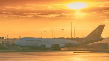 White passenger plane on airport during dawntime