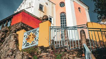 A colorful building with a steeple on top of it in Portmeirion