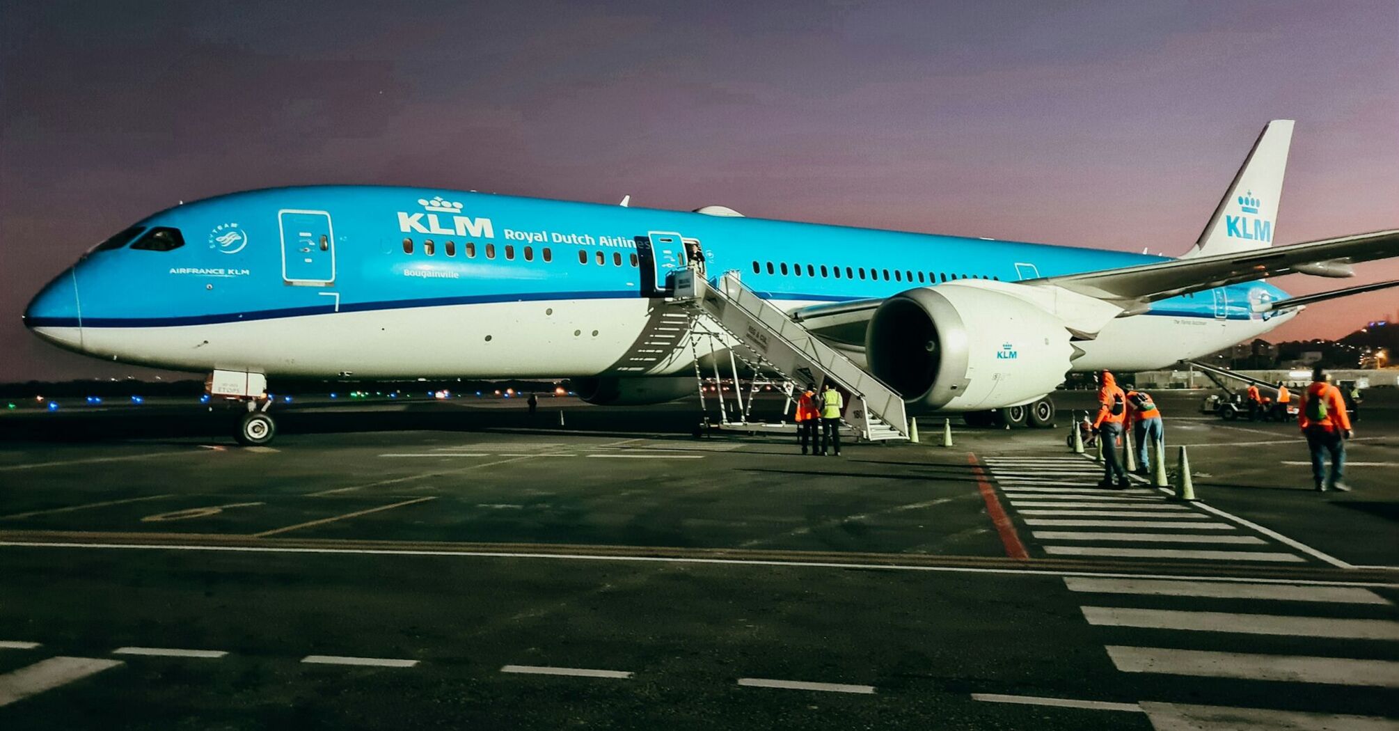 KLM Royal Dutch Airlines Boeing aircraft parked on the tarmac during twilight