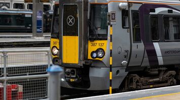 A train on a track in Heathrow train station