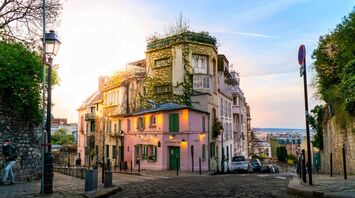 People walking on Montmartre near buildings during daytime